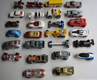 All 26 toy cars laid out in five rows