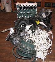 Pile showing all flood lights, string lights, power hub, bulb rack