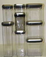 Front view of all eight OXO POP containers stacked