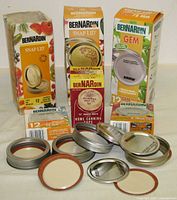 Group view of unopened boxes and loose lids/rings