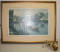 Full Keirstead framed print with detached gold picture light on table