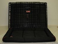 Folded KONG wire crate with mat inside
