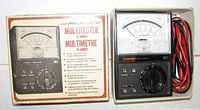 Multimeter and box front showing model and scale