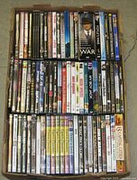 Box containing three rows of DVD cases