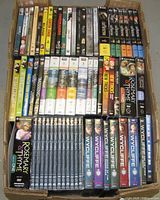 Top-down view of large carton showing rows of DVD cases