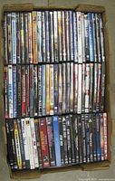 Open box showing entire assortment of DVD cases in rows