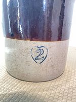 Front lower section showing cobalt blue heart mark with 2