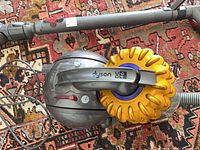 Top view of Dyson Big Ball canister vacuum showing DC46 label and cyclonic bin