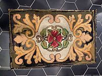 Full view of rug showing design and wear