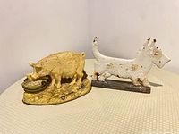 Overview of both cast-iron doorstops