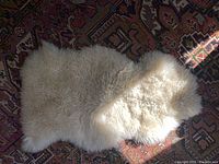 Top view of entire sheepskin rug showing size, shape and color