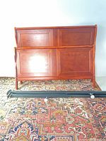 Front view of headboard, footboard and metal rails