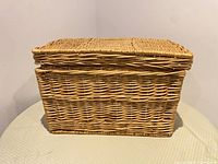 Closed wicker basket front view showing overall shape and weave