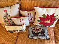All six pillows arranged on sofa showing designs and sizes