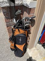 Bag with clubs leaning against wall