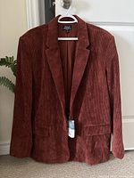 Front view of sienna brown corduroy blazer on hanger