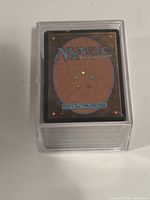 Deck back of MTG card inside clear case