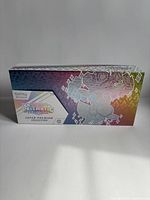 Front view of Pokémon TCG Super-Premium Collection box showing prismatic design and Eevee outline