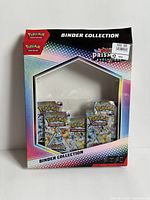 Front of opened binder collection packaging showing missing binder and visible card boxes