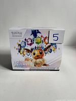 Front of Pokemon Prismatic Evolutions Elite Trainer Box showing Eevee artwork and set name