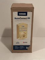 Front of sealed Weiser Home Connect 620 smart lock box showing product image and details