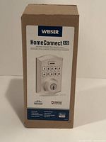 Front of boxed Weiser HomeConnect 620 smart lock showing product information and image