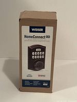 Front of unopened Weiser HomeConnect 620 smart lock box