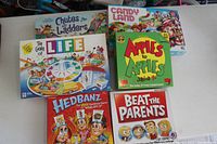 All six game boxes arranged on table