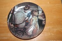 Front of "Make Believe" plate showing two girls with wicker pram