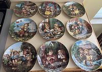 Nine of the eleven Little Companions plates displayed