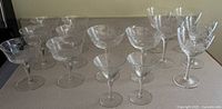 All 15 etched crystal stemware pieces displayed together