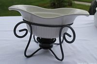 Farberware white ceramic gravy bowl on black metal stand