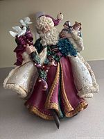 Front view of Father Christmas figurine showing colors, details and overall condition.