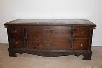 Front view of Lane cedar chest showing drawer-style front and hardware