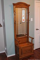 Full view of oak hall tree with mirror and bench