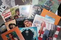 Front assortment of LPs including Kenny Rogers, Springsteen, Dylan, Whitney Houston and Air Supply