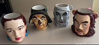 Front view of four character mugs