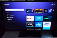 Front view of Samsung plasma TV powered on displaying Roku interface