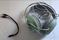 Headset coiled with attached cable and separate splitter adapter