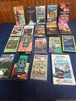 Full lot overview – 19 VHS tapes laid out on table