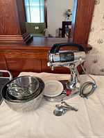 Mixer with bowls, attachments, measuring spoons and power cord