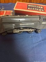 Side view of 265E locomotive with box behind