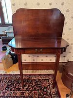 Front view of vanity showing backsplash, top, legs, and drawer