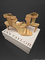 Pair of peach glow Ann Taylor sandals on original box
