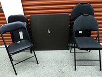 Table and four chairs front view