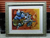 Front view of framed serigraph showing artwork and ornate frame