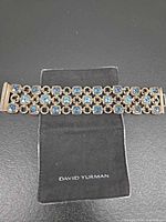 Bracelet front view on pouch showing overall design and gemstones