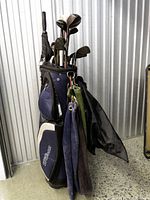 Full view of Wilson bag with clubs, umbrella, towels