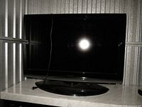 Front view of Toshiba 32" TV on stand