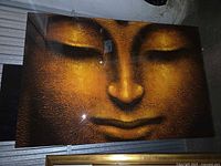 Full panel leaning against wall showing Buddha face design